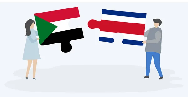 Pareja Sosteniendo Dos Piezas Rompecabezas Con Banderas Sudanesas Costarricenses Sudán — Archivo Imágenes Vectoriales