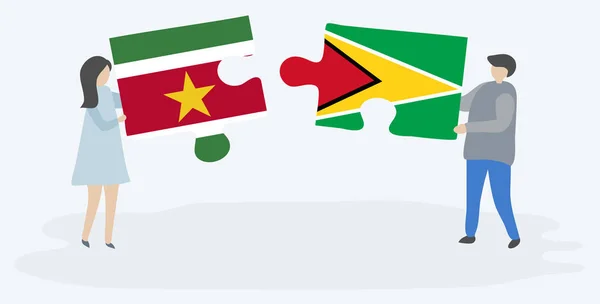 Pareja Sosteniendo Dos Piezas Rompecabezas Con Banderas Suriname Guyana Surinam — Vector de stock