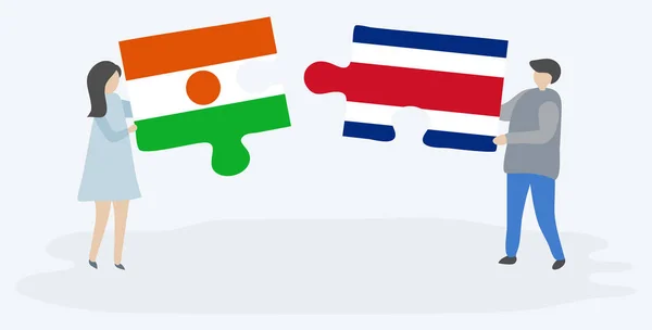 Dvojice Drží Dvě Skládanky Nigerien Costa Rican Vlajkami Národní Symboly — Stockový vektor