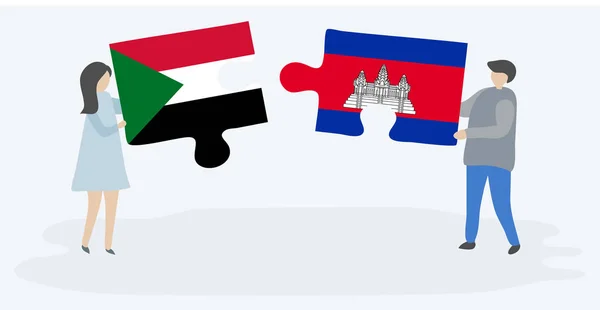 Casal Segurando Duas Peças Quebra Cabeças Com Bandeiras Sudanesas Cambojanas — Vetor de Stock
