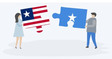 Liberya ve Somali bayrakları ile iki bulmaca parçaları tutan çift. Liberya ve Somali ulusal sembolleri birlikte.