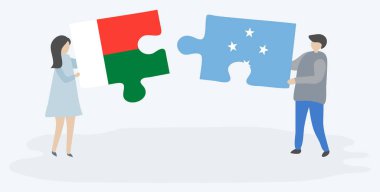 Çift Malagasy ve Mikronezya bayrakları ile iki bulmaca parçaları tutan. Madagaskar ve Mikronezya ulusal semboller i.