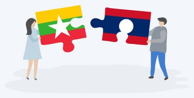 Çift Birmanya ve Lao bayrakları ile iki bulmaca parçaları tutan. Myanmar ve Laos ulusal sembolleri birlikte.