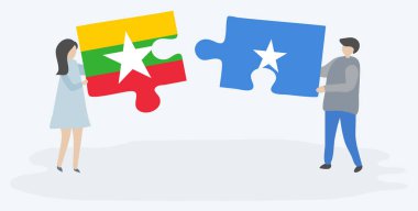 Birmanya ve Somali bayrakları ile iki bulmaca parçaları tutan çift. Myanmar ve Somali ulusal sembolleri bir arada.
