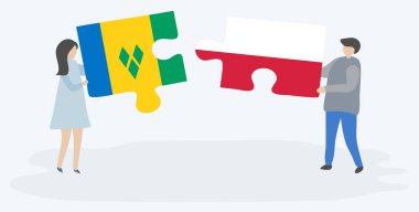 Vincentian ve Polonya bayrakları ile iki bulmaca parçaları tutan çift. Saint Vincent ve Grenadinler ve Polonya ulusal sembolleri birlikte.