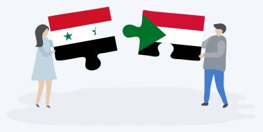 Suriye ve Sudan bayrakları yla iki bulmaca tutan çift. Suriye ve Sudan ulusal sembolleri birlikte.
