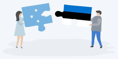 Mikronezya ve Estonya bayrakları ile iki bulmaca parçaları tutan çift. Mikronezya ve Estonya ulusal sembolleri birlikte.