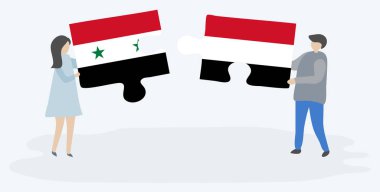 Suriye ve Yemen bayrakları ile iki bulmaca parçaları tutan çift. Suriye ve Yemen ulusal sembolleri birlikte.