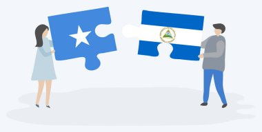 Çift Somali ve Nikaragua bayrakları ile iki bulmaca parçaları tutan. Somali ve Nikaragua ulusal sembolleri birlikte.