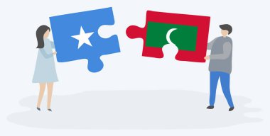 Çift Somali ve Maldiv bayrakları ile iki bulmaca parçaları tutan. Somali ve Maldivler ulusal semboller birlikte.