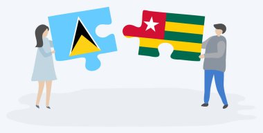 Saint Lucian ve Togolese bayrakları ile iki bulmaca parçaları tutan çift. Saint Lucia ve Togo ulusal sembolleri birlikte.