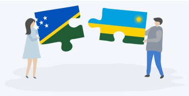 Solomon Adası ve Ruanda bayrakları ile iki bulmaca parçaları tutan çift. Solomon Adaları ve Ruanda ulusal sembolleri birlikte.