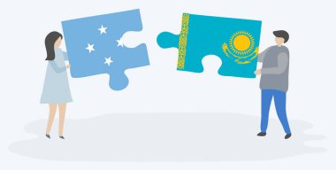 Mikronezya ve Kazak bayrakları ile iki bulmaca parçaları tutan çift. Mikronezya ve Kazakistan ulusal sembolleri birlikte.