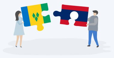 Vincentian ve Lao bayrakları ile iki bulmaca parçaları tutan çift. Saint Vincent ve Grenadinler ve Laos ulusal sembolleri birlikte.