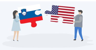 Sloven ve Amerikan bayrakları ile iki bulmaca parçaları tutan çift. Slovenya ve Amerika Birleşik Devletleri ulusal sembolleri birlikte.