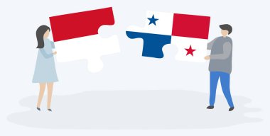 Monegasque ve Panama bayrakları ile iki bulmaca parçaları tutan çift. Monako ve Panama ulusal sembolleri birlikte.