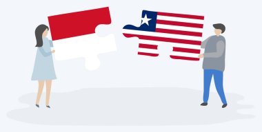 Monegasque ve Liberya bayrakları ile iki bulmaca parçaları tutan çift. Monako ve Liberya ulusal sembolleri birlikte.