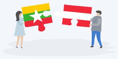 Çift Birmanya ve Avusturya bayrakları ile iki bulmaca parçaları tutan. Myanmar ve Avusturya ulusal sembolleri bir arada.