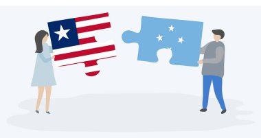 Liberya ve Mikronezya bayrakları ile iki bulmaca parçaları tutan çift. Liberya ve Mikronezya ulusal sembolleri birlikte.