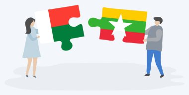 Çift Malagasy ve Birmanya bayrakları ile iki bulmaca parçaları tutan. Madagaskar ve Myanmar ulusal sembolleri birlikte.