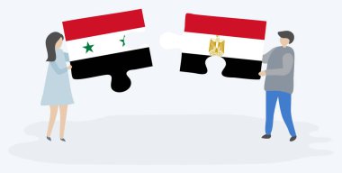 Suriye ve Mısır bayrakları ile iki bulmaca parçaları tutan çift. Suriye ve Mısır ulusal sembolleri birlikte.