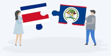 Çift Kosta Rika ve Belizean bayrakları ile iki bulmaca parçaları tutan. Kosta Rika ve Belize ulusal sembolleri birlikte.
