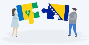 Vincentian ve Bosna bayrakları ile iki bulmaca parçaları tutan çift. Saint Vincent ve Grenadinler ve Bosna-Hersek ulusal sembolleri birlikte.