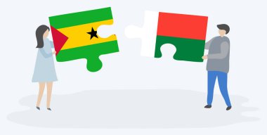 Sao Tomean ve Malagasy bayrakları ile iki bulmaca parçaları tutan çift. Sao Tome ve Principe ve Madagaskar ulusal sembolleri birlikte.