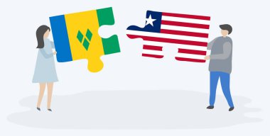 Vincent ve Liberya bayrakları ile iki bulmaca parçaları tutan çift. Saint Vincent ve Grenadinler ve Liberya ulusal sembolleri birlikte.