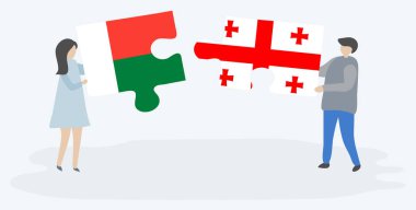 Çift Malagasy ve Gürcü bayrakları ile iki bulmaca parçaları tutan. Madagaskar ve Gürcistan ulusal sembolleri birlikte.