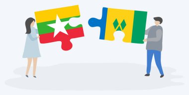 Çift Birmanya ve Vincentian bayrakları ile iki bulmaca parçaları tutan. Myanmar ve Saint Vincent ve Grenadinler ulusal sembolleri birlikte.