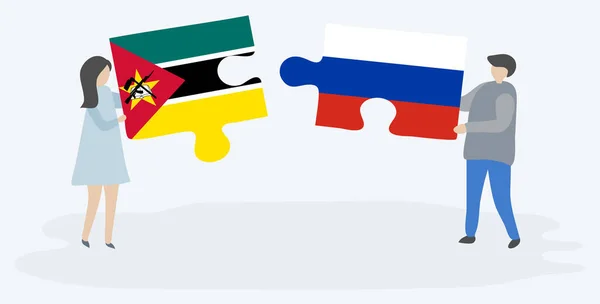 Paar Houden Twee Puzzels Stukken Met Mozambibaanse Russische Vlaggen Mozambique — Stockvector