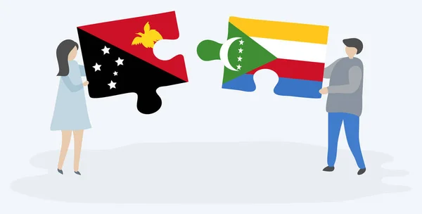 一对夫妇拿着两块拼图 上面挂着巴布亚和科摩罗国旗 巴布亚新几内亚和科摩罗国家符号在一起 — 图库矢量图片