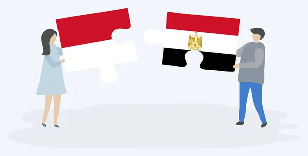 一对夫妇拿着两个拼图片与摩纳哥和埃及国旗 摩纳哥和埃及国家符号在一起 — 图库矢量图片