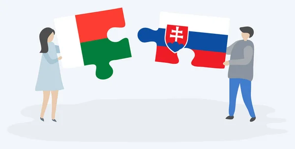 Couple Holding Two Puzzles Pieces Malagasy Slovak Flags Madagascar Slovakia — Stock Vector