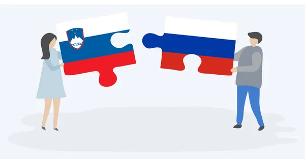 Paar Houden Twee Puzzels Stukken Met Sloveense Russische Vlaggen Slovenië — Stockvector