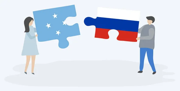 Para Trzyma Dwa Puzzle Kawałki Mikronezyjskich Rosyjskich Flag Mikronezja Rosja — Wektor stockowy