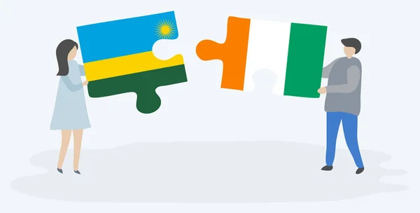 Paar Houden Twee Puzzels Stukken Met Rwankaanse Ivoriaanse Vlaggen Rwanda — Stockvector