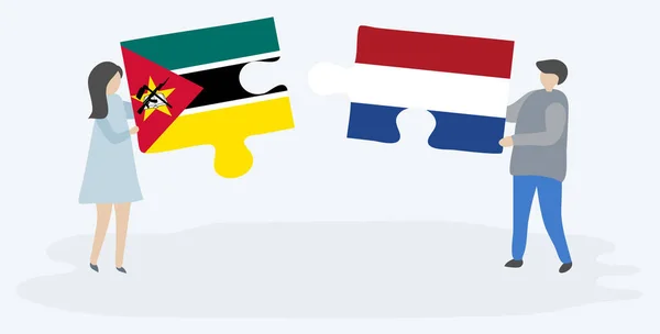 Paar Houden Twee Puzzels Stukken Met Mozambican Nederlandse Vlaggen Mozambique — Stockvector