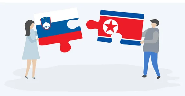 Par Holder Puslespil Stykker Med Slovenske Nordkoreanske Flag Slovenien Nordkorea – Stock-vektor