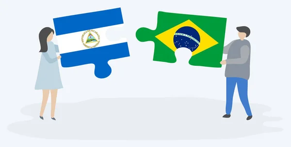 Couple Tenant Deux Pièces Puzzles Avec Des Drapeaux Nicaraguayen Brésilien — Image vectorielle