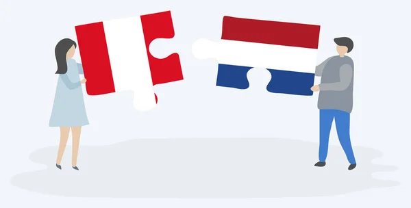 ペルーとオランダの旗と2つのパズルのピースを保持しているカップル ペルーとオランダのシンボル — ストックベクタ