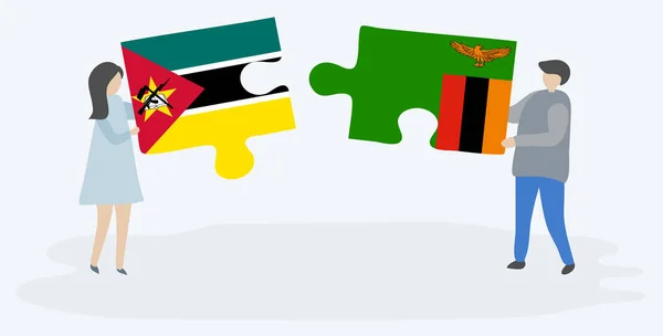 Paar Houden Twee Puzzels Stukken Met Mozambican Zambiaanse Vlaggen Mozambique — Stockvector