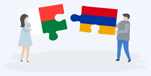 Para Trzyma Dwa Kawałki Puzzli Madagaskaru Ormiańskich Flag Madagaskar Armenii — Wektor stockowy