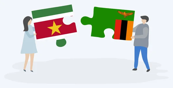Surinam Zambiya Bayrakları Ile Iki Bulmaca Parçaları Tutan Çift Surinam — Stok Vektör