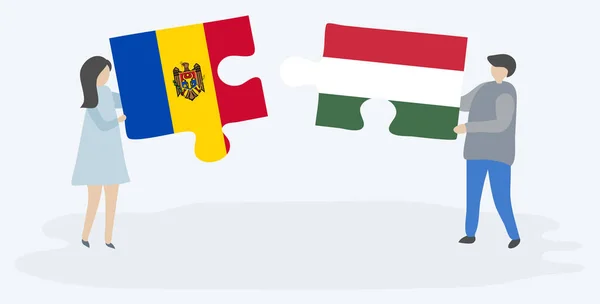 モルドバとハンガリーの旗を持つ2つのパズルのピースを保持しているカップル モルドバとハンガリーのシンボル — ストックベクタ