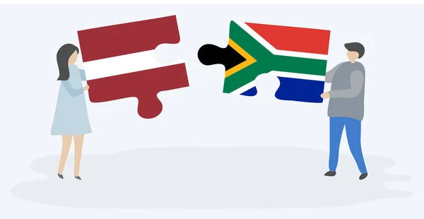 Пара Держащая Две Головоломки Латвийскими Южноафриканскими Флагами Латвия Южная Африка — стоковый вектор