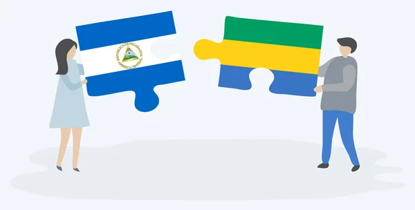 Casal Segurando Duas Peças Quebra Cabeças Com Bandeiras Nicaraguenses Gabonesas —  Vetores de Stock