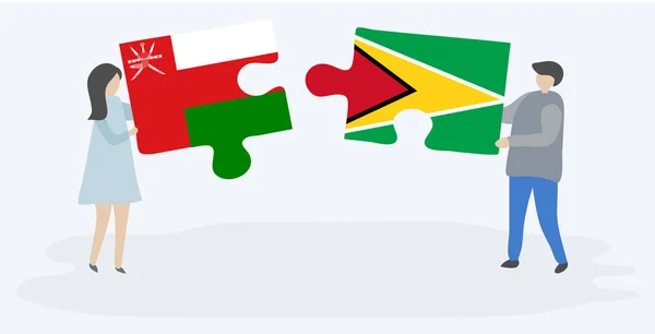 オマーンとガイアナの旗を持つ2つのパズルピースを保持しているカップル オマーンとガイアナの国のシンボル — ストックベクタ