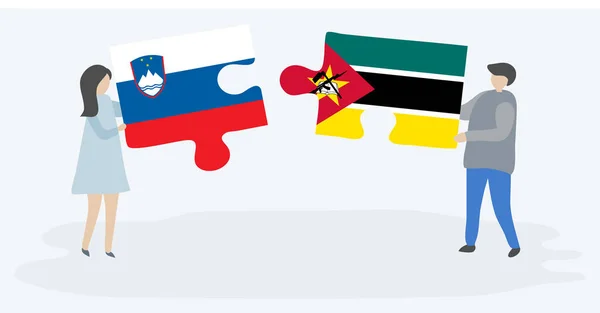 Couple Tenant Deux Pièces Puzzles Avec Des Drapeaux Slovène Mozambicain — Image vectorielle